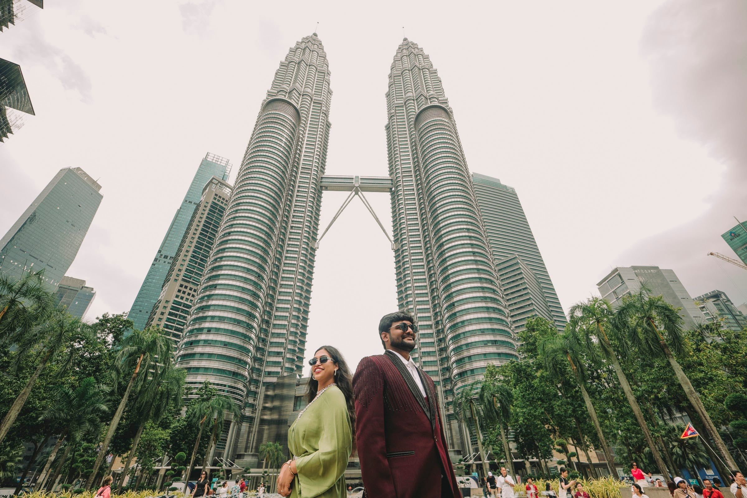 Couple below the Petronas Towers, Kuala Lumpur